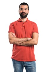 Man wearing red polo shirt with his arms crossed
