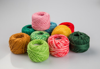 Set of colorful wool yarn balls. Hanks are set out in a pile.