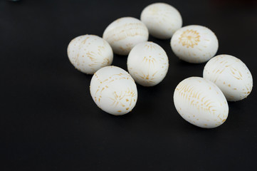 Easter eggs decorated with wax, isolated on black background