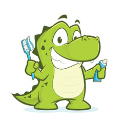 Obraz premium Crocodile or alligator holding toothbrush and toothpaste