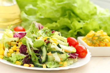 Salad made of fresh vegetables with oil