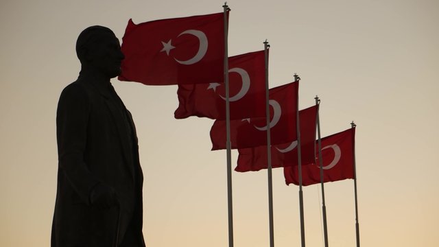 Ataturk statue and Turkish flags waving at Izmir