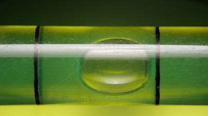 Carpenter's spirit level close up. Measuring the flatness with a spirit level.