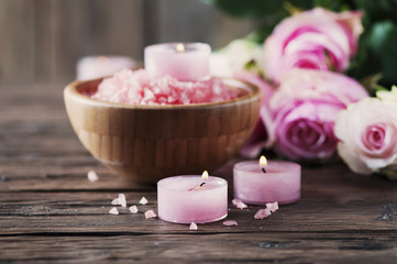 Fototapeta na wymiar SPA treatment with pink salt and candles
