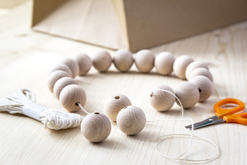 Wooden beads on a wooden background