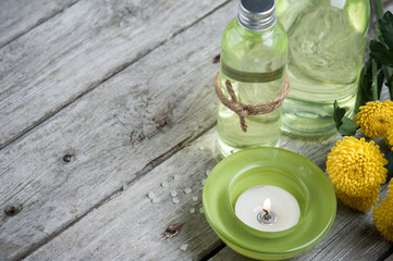 Bath products, candles, wooden background