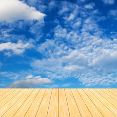 Blue sky blurred background and old brown wooden floor.