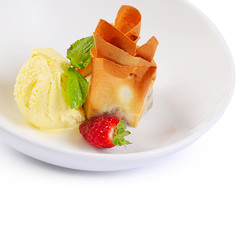 The vanilla ice cream with strawberries