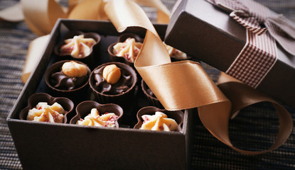 Chocolate sweets on fabric background