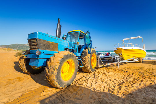 Huge tracktor hanging boats on the beach of Zakynthos, Greece