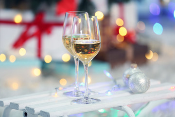 Two glasses of wine on Christmas decoration background