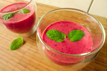 Smoothie with yogurt, raspberry, strawberry and blueberry