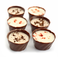 Assorted chocolate candies, isolated on white