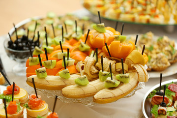 Dish with assorted snacks on a table