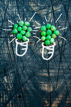 Two green lamps with peas