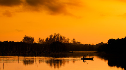 Fototapeta premium Landscape silhouette at sunrise.