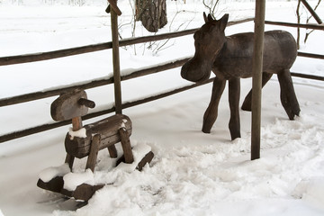 Wooden rocking-horse and moose