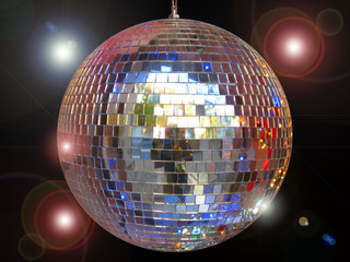 Fototapeta premium Disco ball with sparkles isolated in black