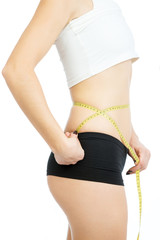 the girl measuring a waist