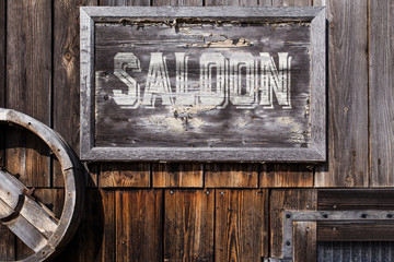 wooden sign with word saloon