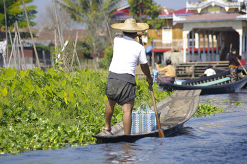 Boat with man on Inle Lake. - 101487937