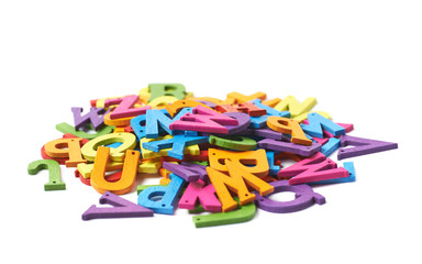 Fototapeta premium Pile of colorful wooden letters isolated