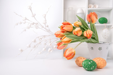 Easter greeting design with bunch of tulips and painted eggs