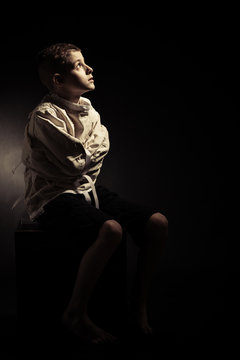 Isolated Lonely Young Boy Looking Up Seriously