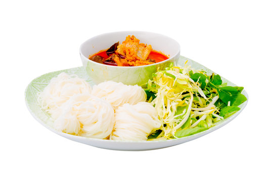 Thai vermicelli eaten with chicken curry isolated on white backg