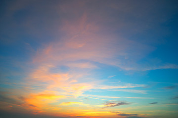 Beautiful yellow - orange sky at sunset in  summer .