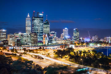 Fototapeta na wymiar Night view with skyscrapers and light trails in Perth, Australia