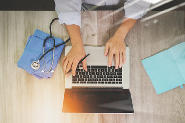 top view of Medicine doctor hand working with modern computer an