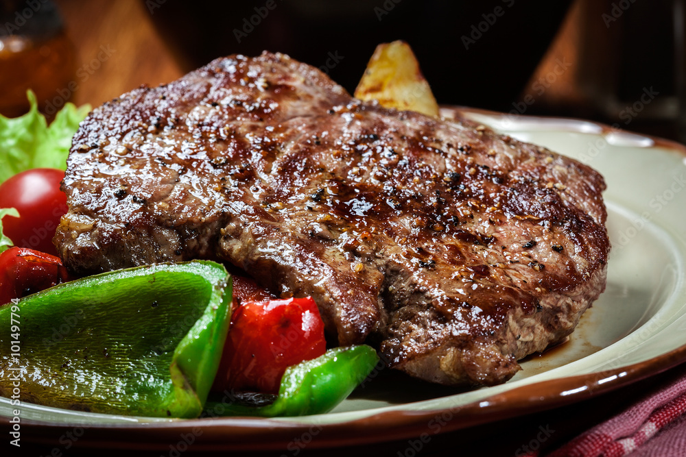 Canvas Prints portions of grilled beef steak with grilled potatoes and paprika