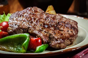  Portions of grilled beef steak with grilled potatoes and paprika © Sławomir Fajer