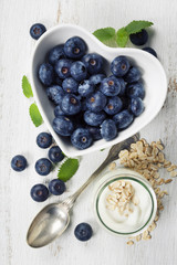 Healthy breakfast of muesli, berries with yogurt and seeds