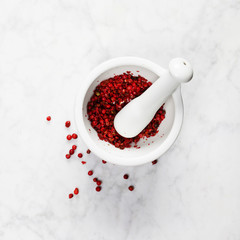 Mortar and pestle with red peppercorns