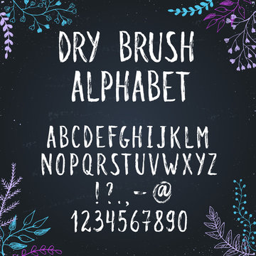 Hand drawn narrow and tall letters. Dry brush handwritten alphabet with floral elements on background.  Modern chalk typography.