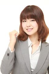 young Japanese woman showing a victory sign