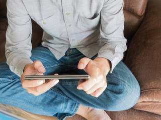 Close up of man finger touch to mobile phone screen. Internet su