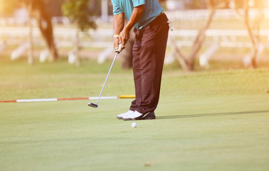 blurred golfers hit sweeping and keep golf course in the summer for relax time
