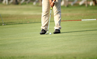 Obraz premium blurred golfers hit sweeping and keep golf course in the summer for relax time