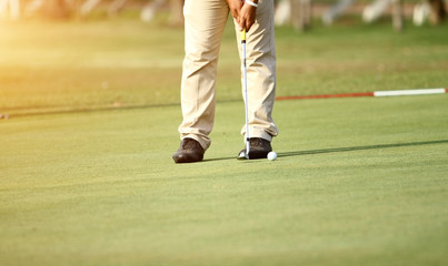 blurred golfers hit sweeping and keep golf course in the summer for relax time