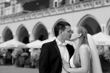 Smooch. Monochrome closeup shot of a happy just married couple kissing