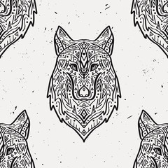 Vector grunge monochrome seamless pattern with tribal style wolf with ethnic ornaments. American indian motifs. Boho design.