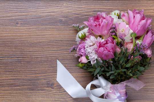 Valentine flowers on wooden background