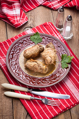 Rolls pork on the plate.