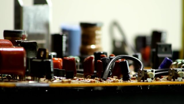 Radio components on rotation electronic board closeup 