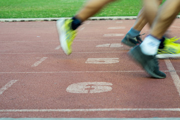 Runners feet in motion on track