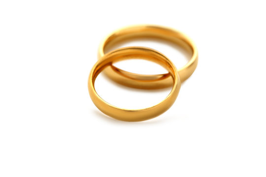 Golden wedding rings isolated on a white
