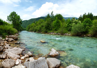 landscape with mountains trees and rapids of river Salza in front